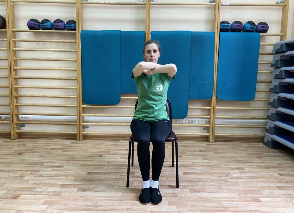 Self-hug — open between the shoulder blades